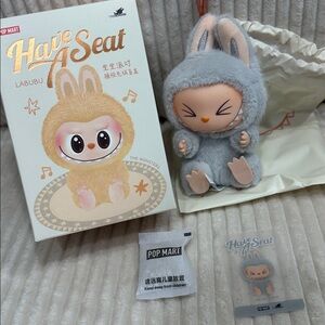 HEHE - Pop Mart Labubu Have A Seat.New. Grey. Color.Box opened to verify. Cute!
